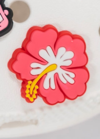 Red and white flower-shaped object on a white background