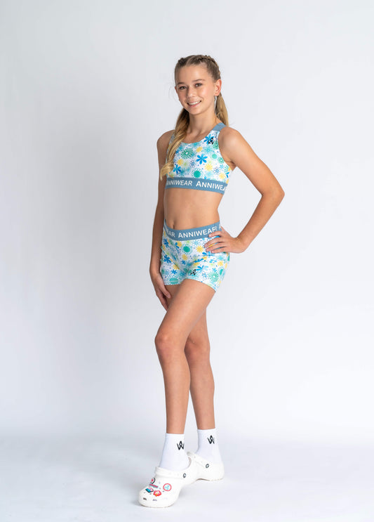 Girl Wearing floral blue and white activewear set