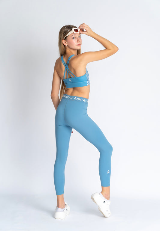 Blue floral sports bra on a person wearing blue leggings