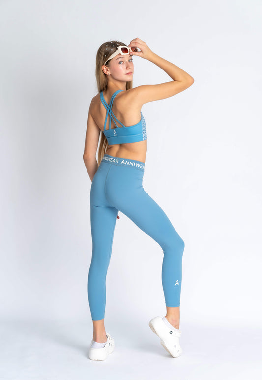 Blue floral sports bra on a person wearing blue leggings