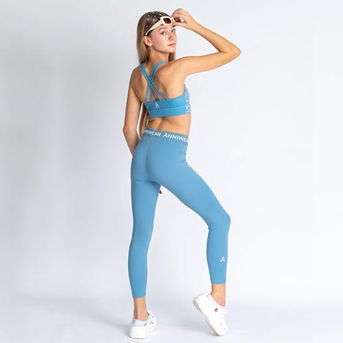 Blue floral sports bra on a person wearing blue leggings