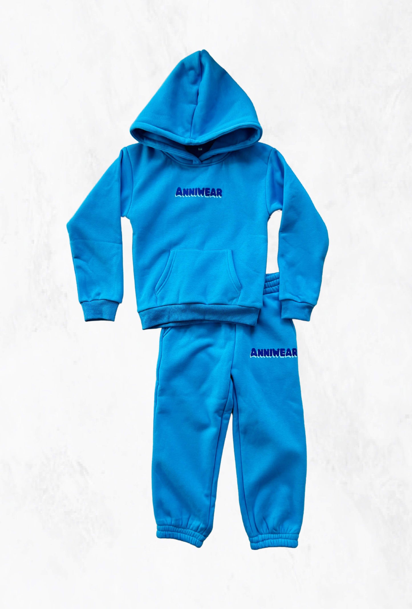 A blue hoodie and track pants set with a branded logo.