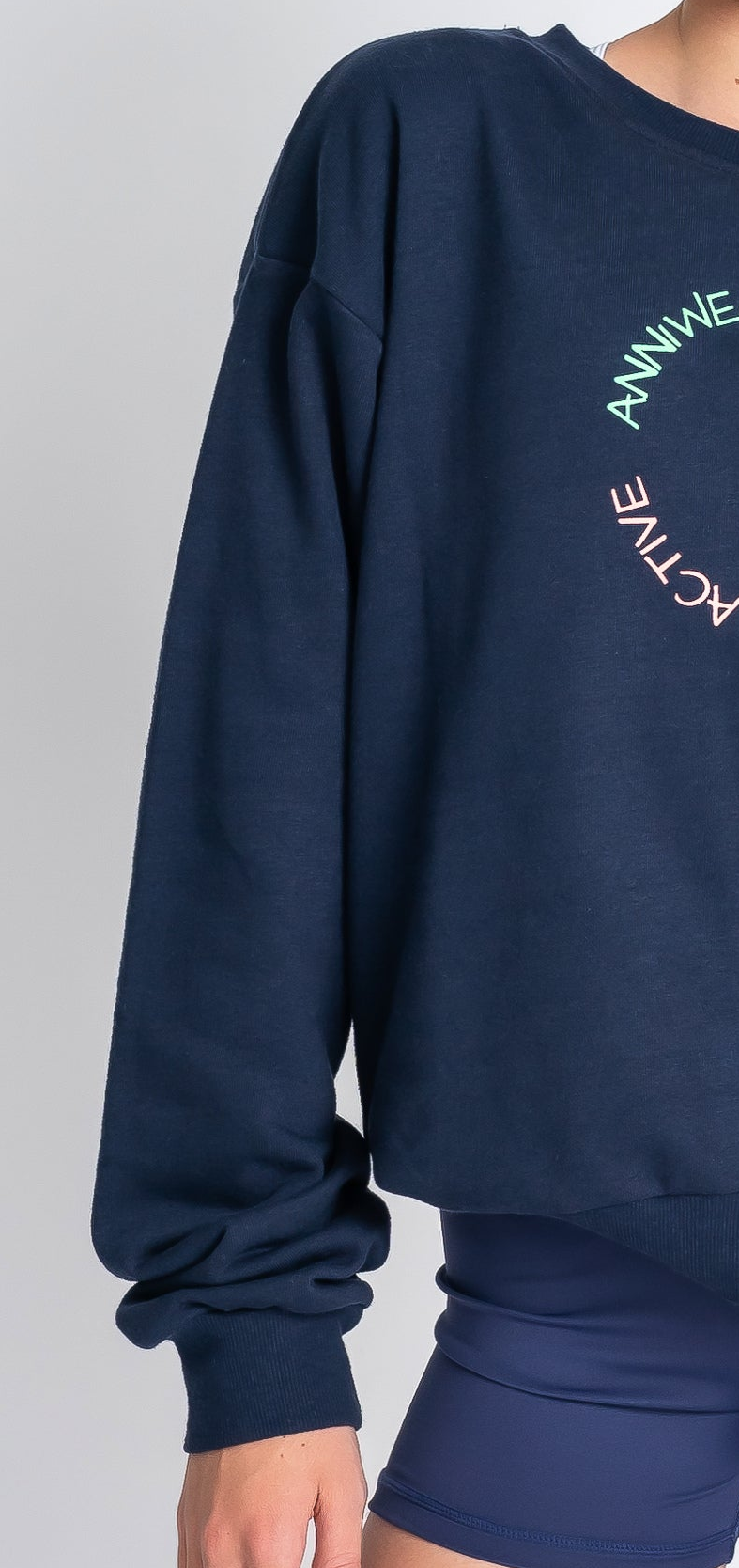 Navy blue sweatshirt with text on a plain background