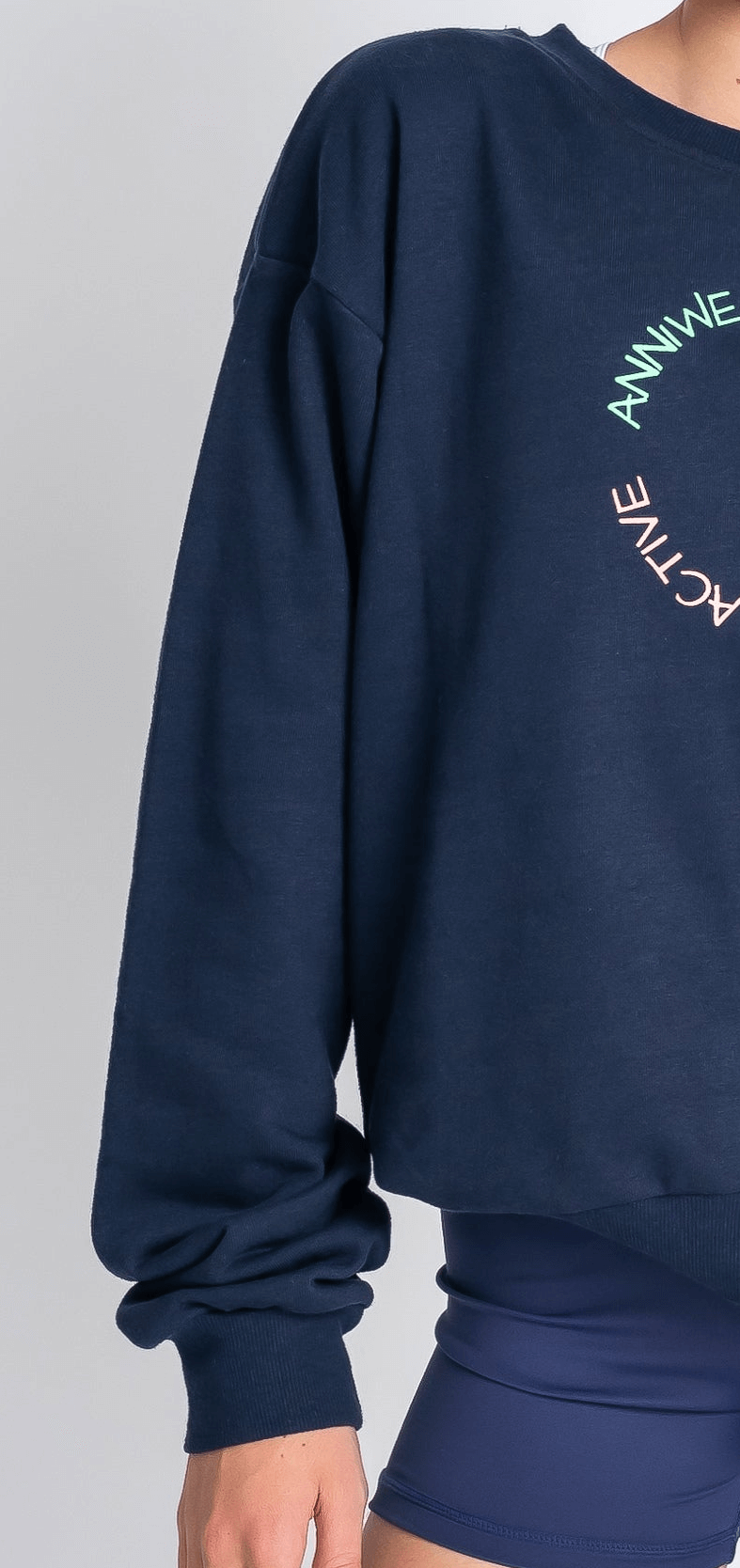 Navy blue sweatshirt with text on a plain background