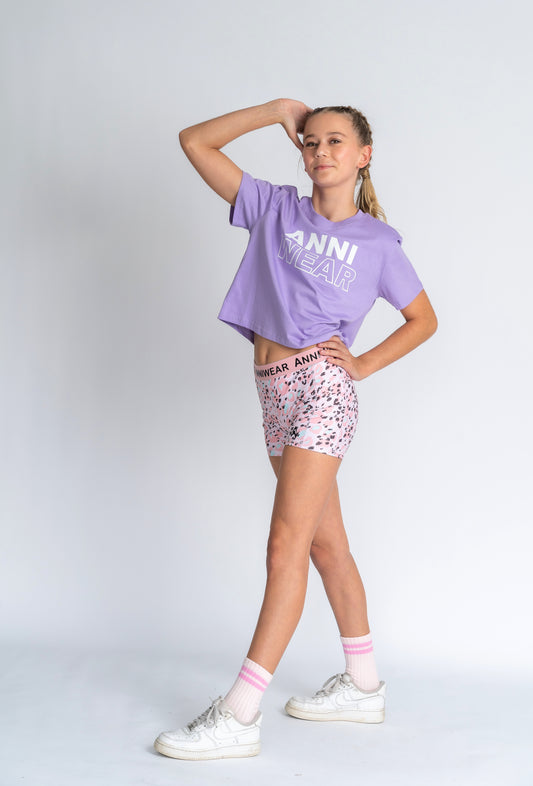 Purple shirt with 'ANNI WEAR' text