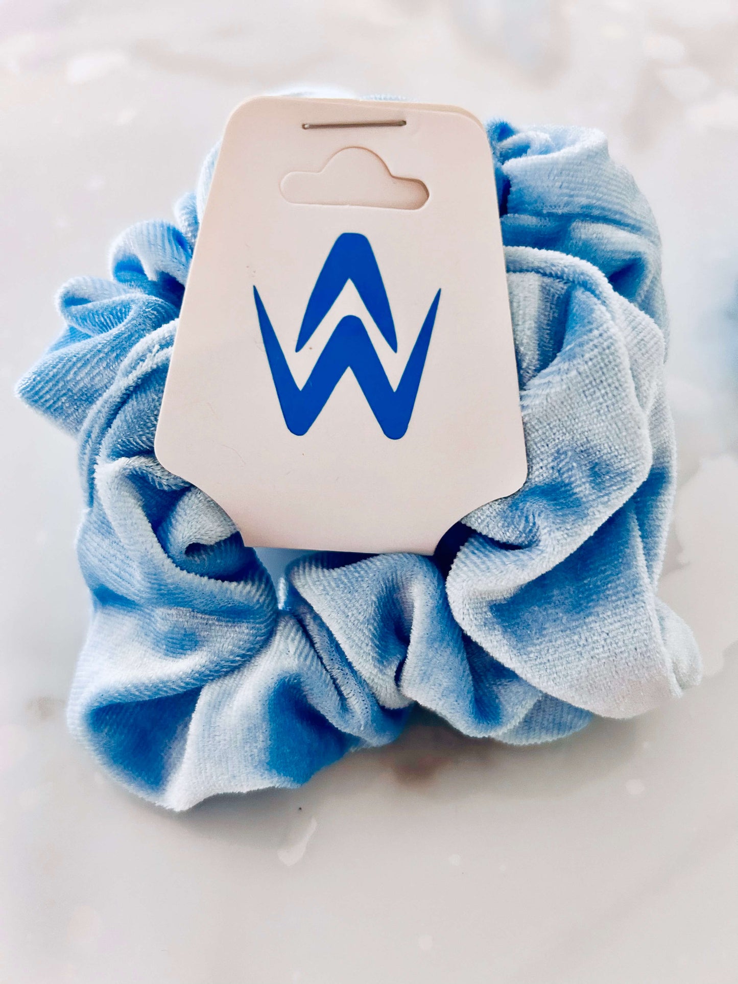 Blue velvet Scrunchie with logo on cardboard hang tag