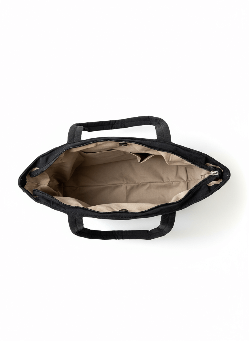 Black bag with beige interior on a white background