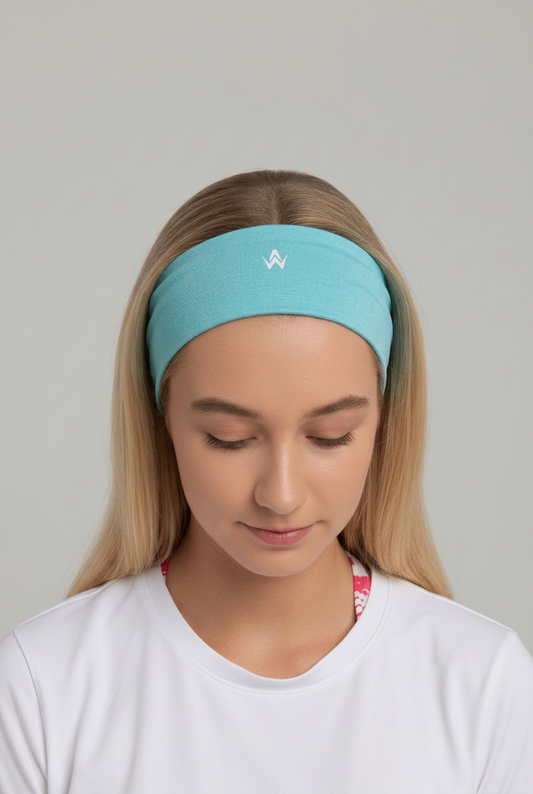 Girl wearing a Light blue headband with a logo on a plain background
