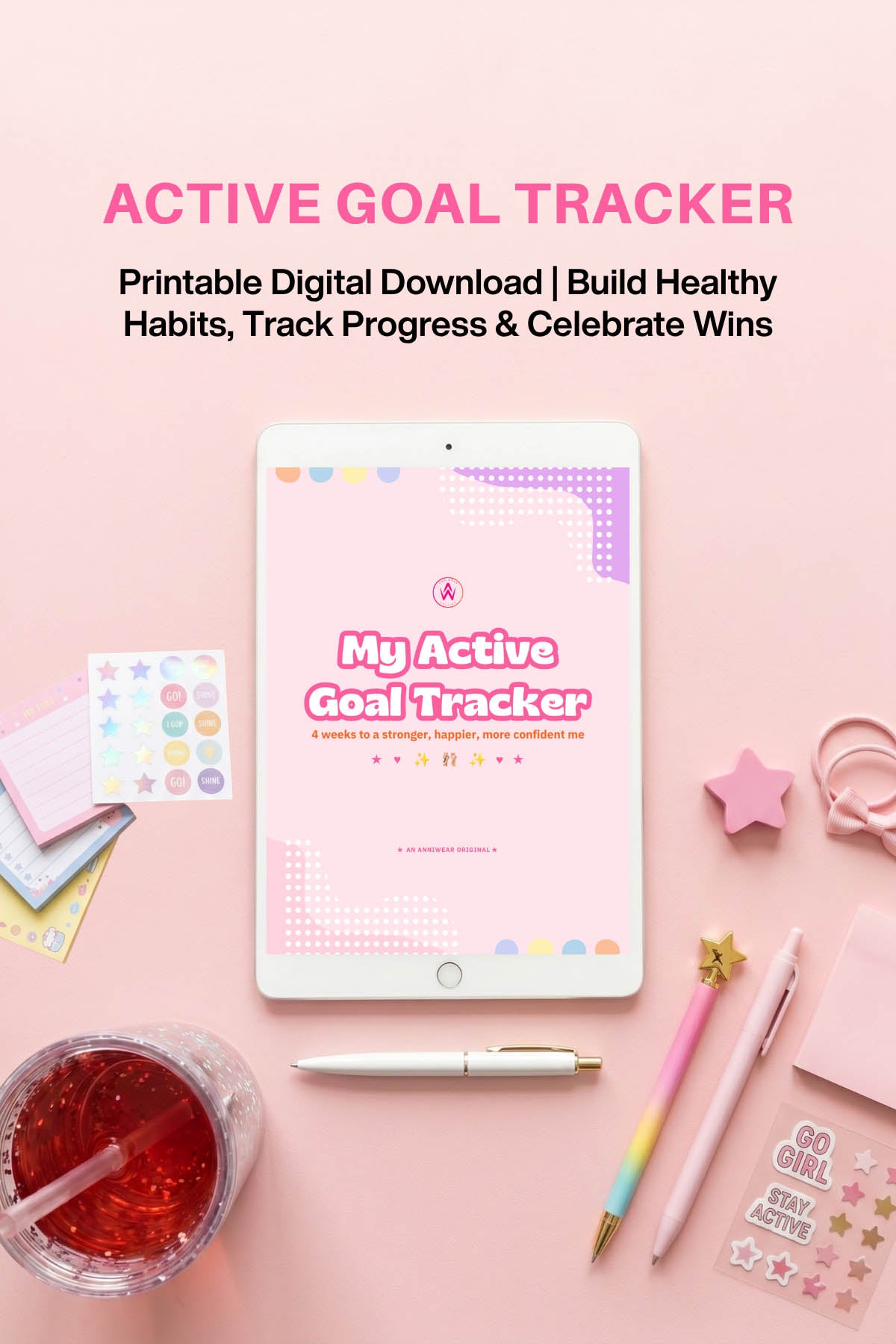 Active Goal Tracker digital download on a pink background with stationery items.