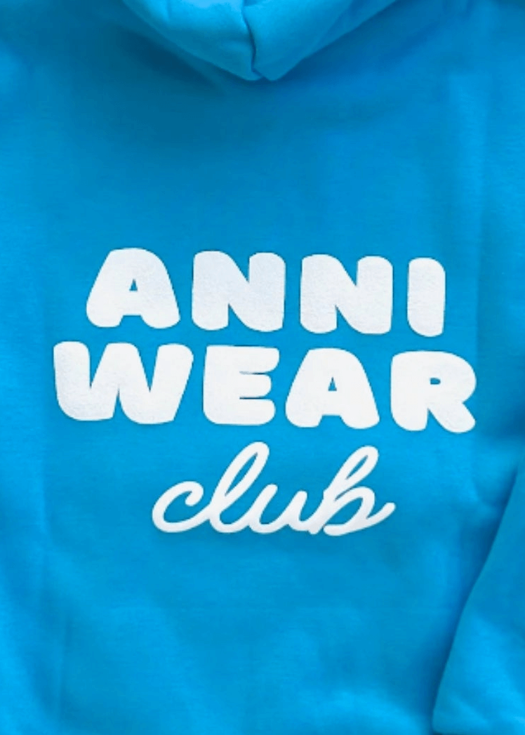 Blue hoodie with 'ANNI WEAR club' text in white