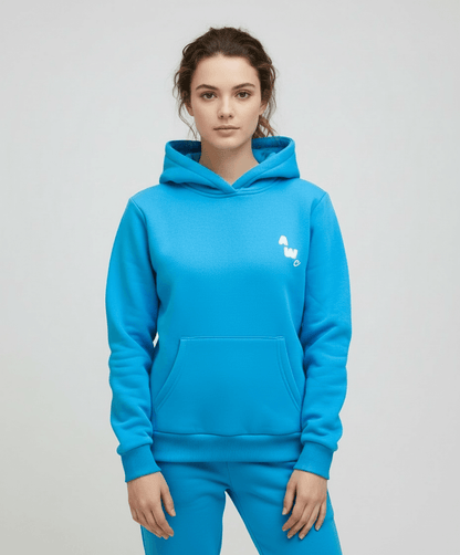 Person wearing a blue hoodie with a small white logo on a light gray background