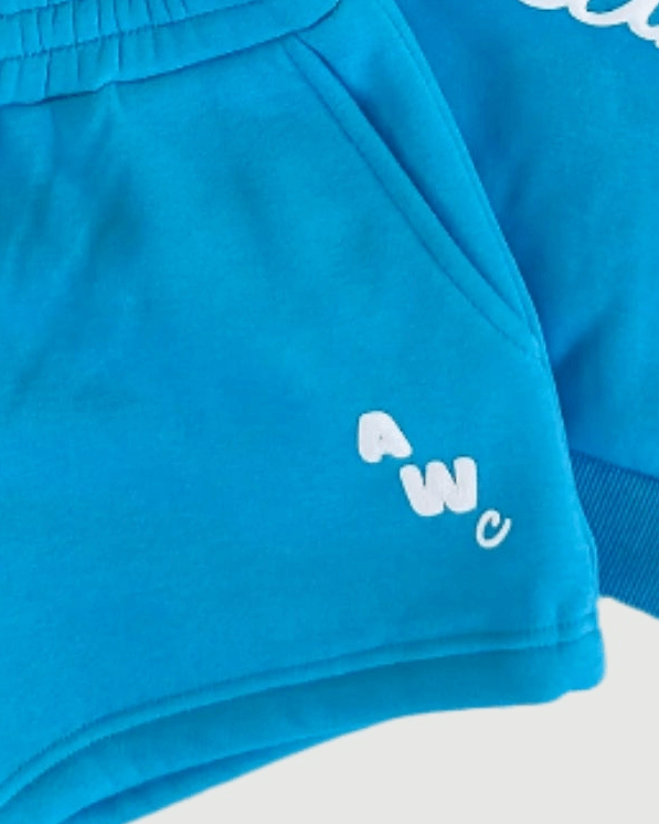 Blue shorts with a white logo on a white background