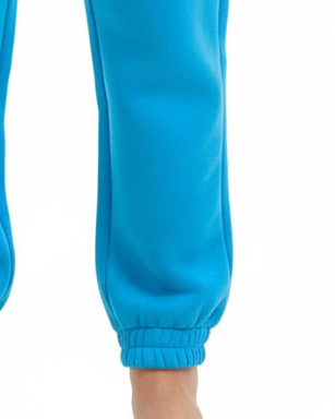 Close-up of blue pants with a white background