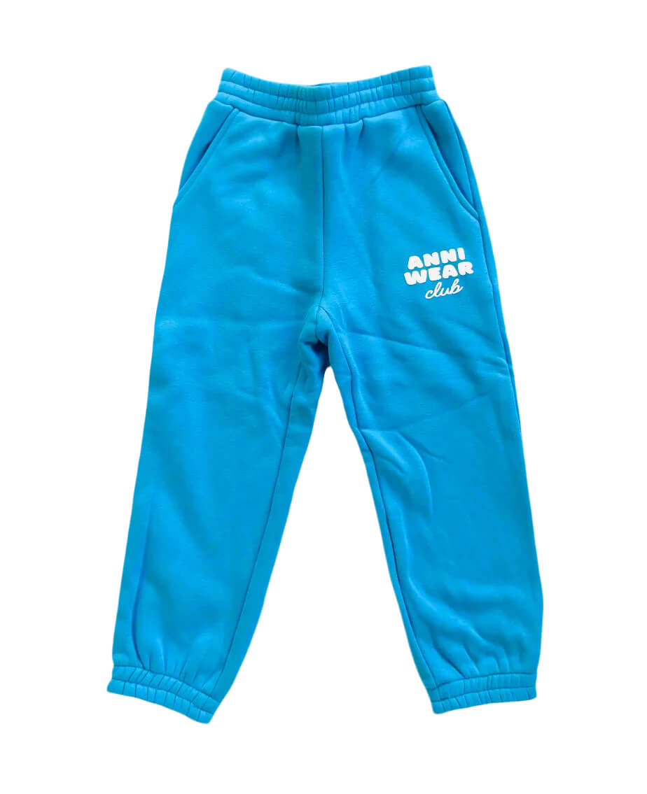 Blue sweatpants with 'Anni Wear Club' text on a white background