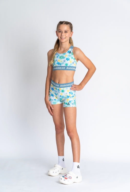 Girl Wearing floral blue and white activewear set