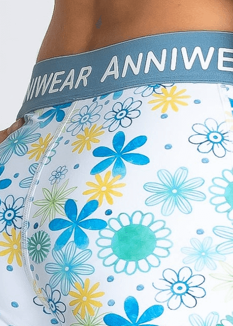 Floral-patterned activewear with 'ANNIWEAR' waistband on a white background