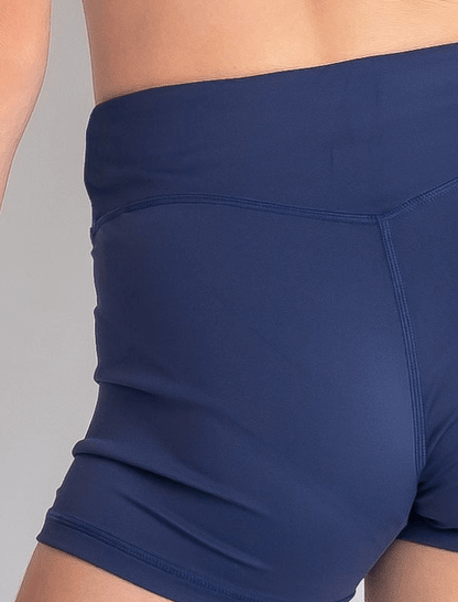 Navy blue athletic shorts on a neutral background