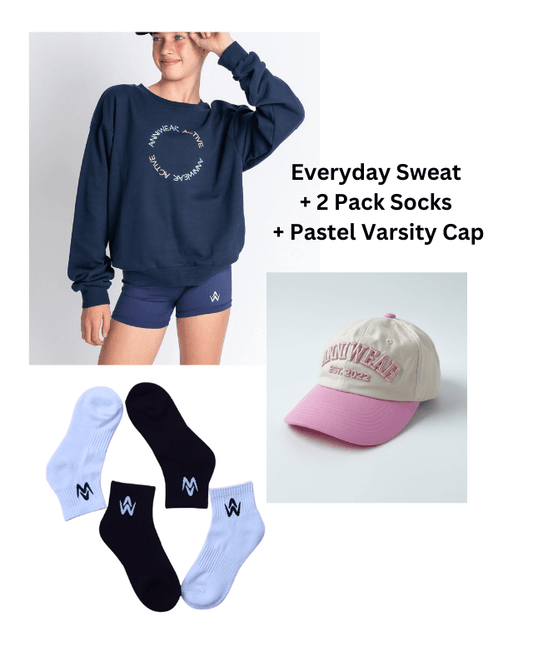 Navy sweatshirt, shorts, socks, and pastel varsity cap with branding on a white background.