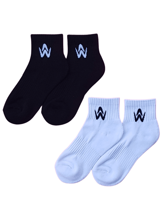 White and black ankle socks with contrast logo on a white background