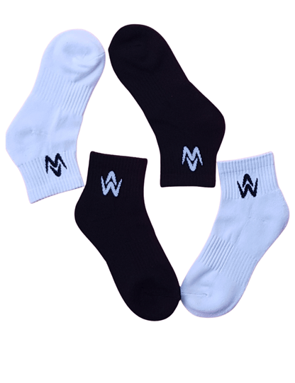 White and black ankle socks with contrast logo on a white background