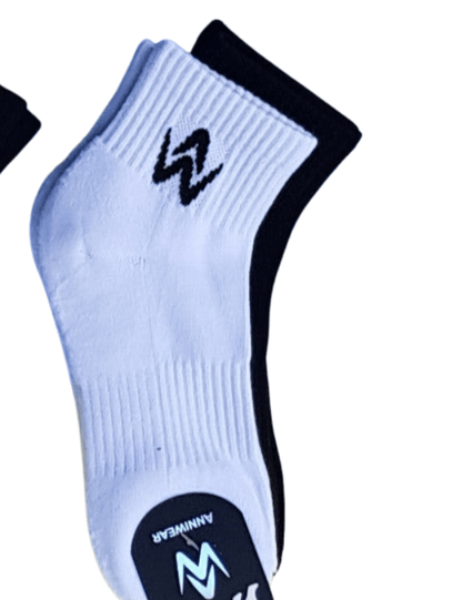 White ankle sock with black cuff and logo on a white background