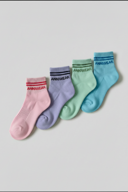 Four colorful socks with 'ANNIWEAR' branding on a light gray background