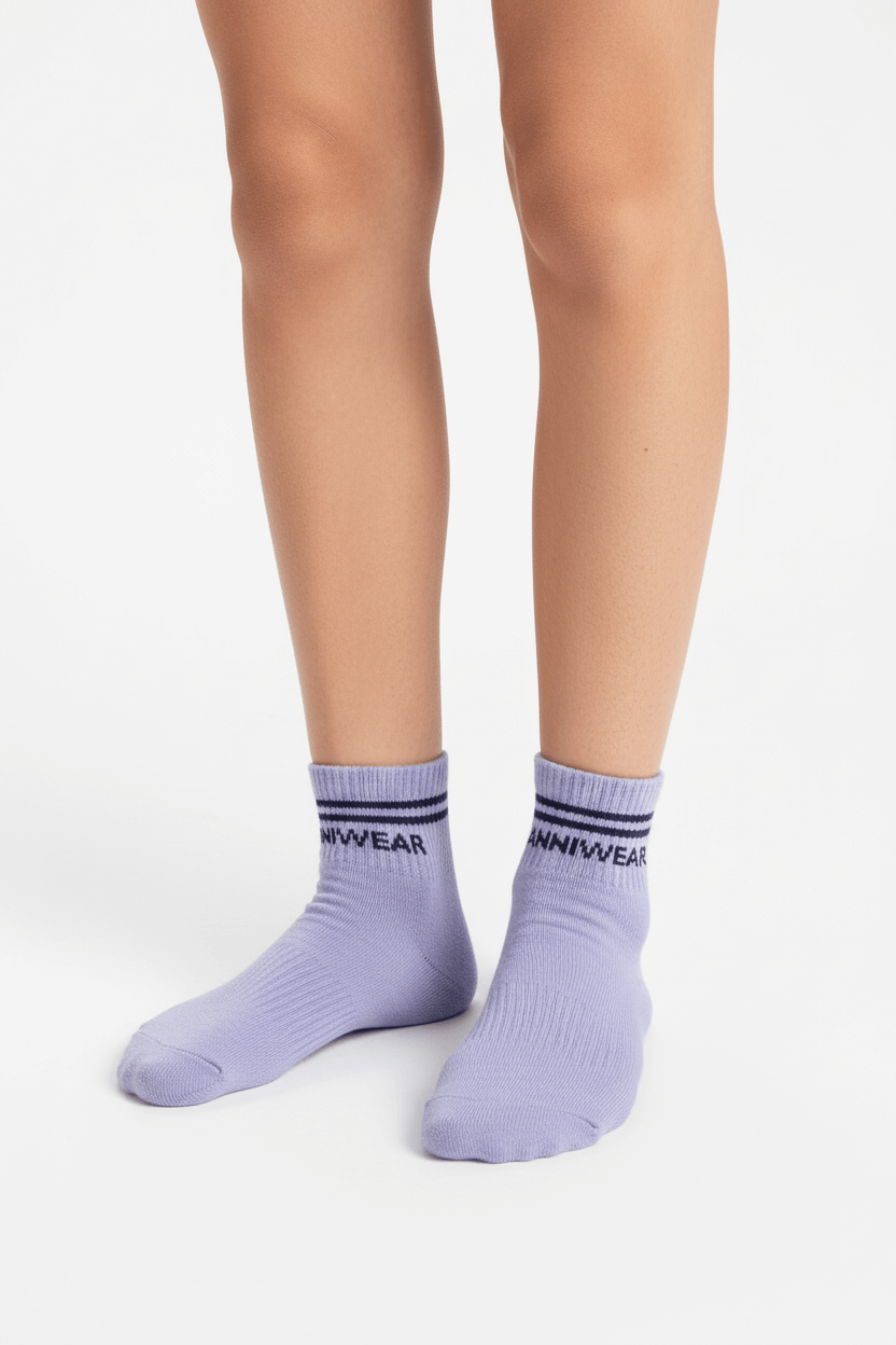 Purple socks with brand name on a white background