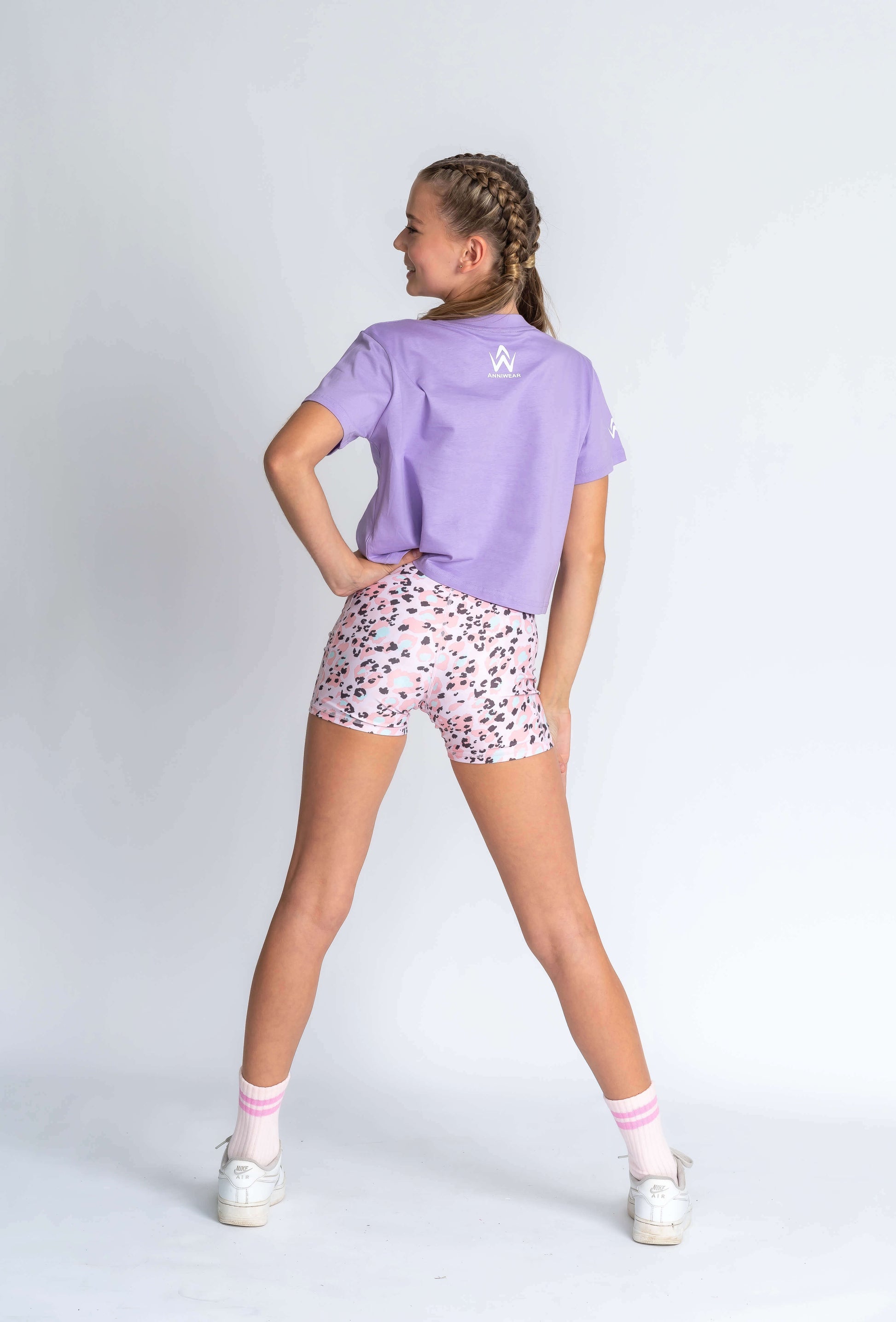 Purple shirt with white logo.