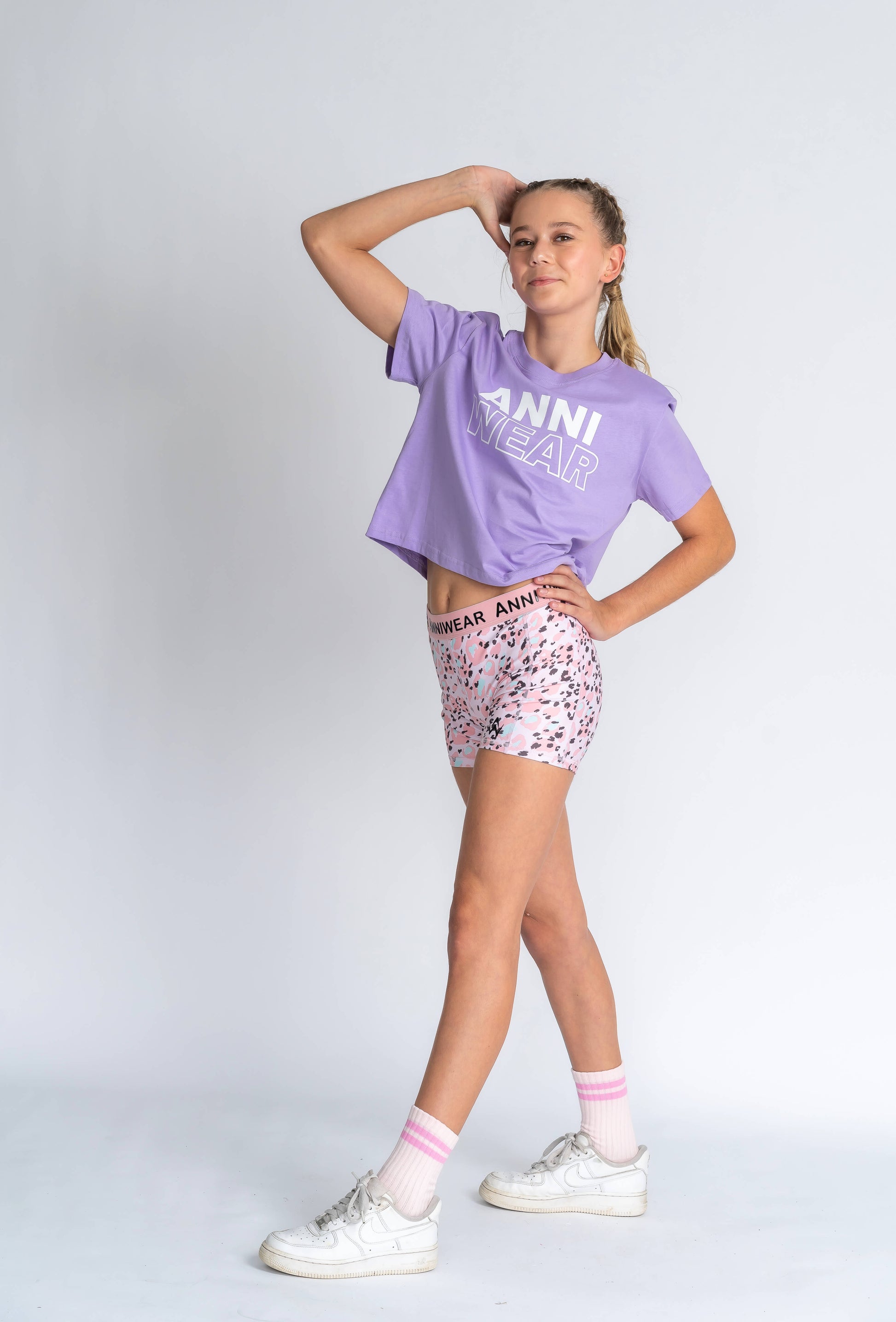 Purple shirt with 'ANNI WEAR' text 