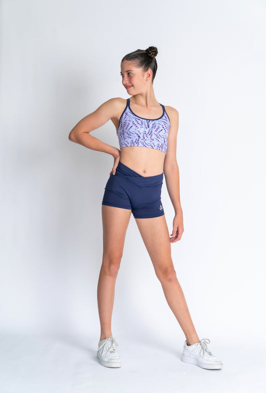 A female model wearing a lavender haze crop top and matching shorts,