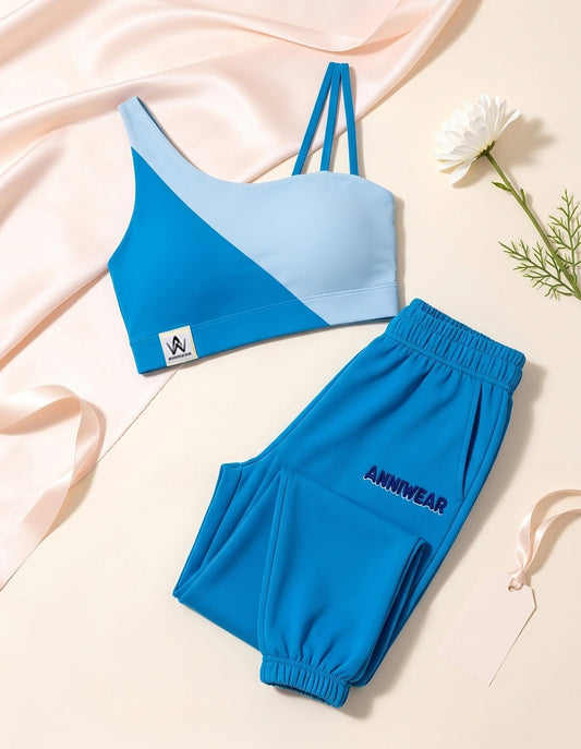Blue sports bra and shorts set with 'ANNIWEAR' branding on a light background.