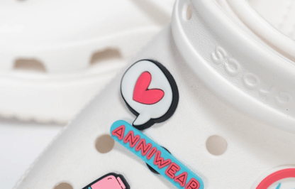 Colorful heart-shaped product with 'ANNIWEAR' branding on a white background
