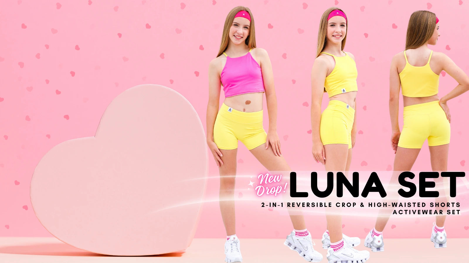 Two women wearing a reversible crop top and high-waisted shorts set with a pink heart and 'LUNA SET' text on a pink background.
