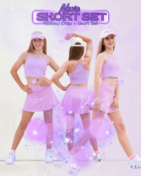 Three women wearing a matching lilac outfit with a  cap and skort set on a white background.