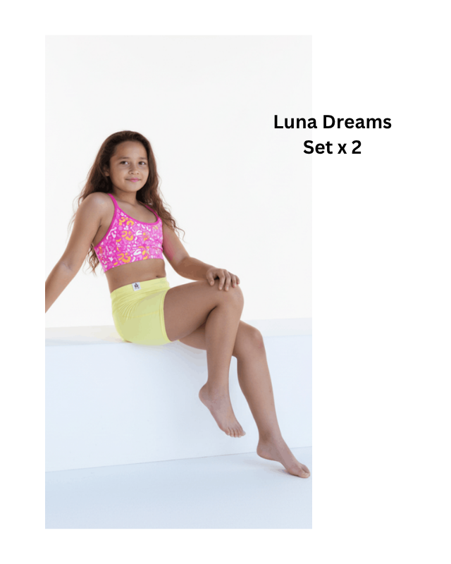 Girl wearing a pink top and yellow shorts with 'Luna Dreams Set x 2' text.