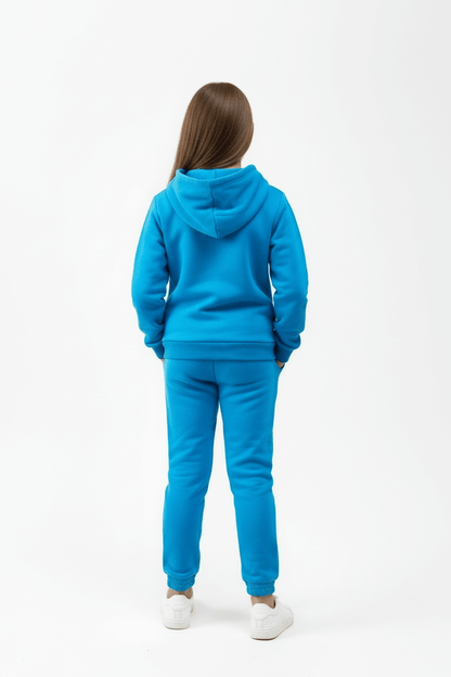 Person wearing a blue tracksuit on a white background