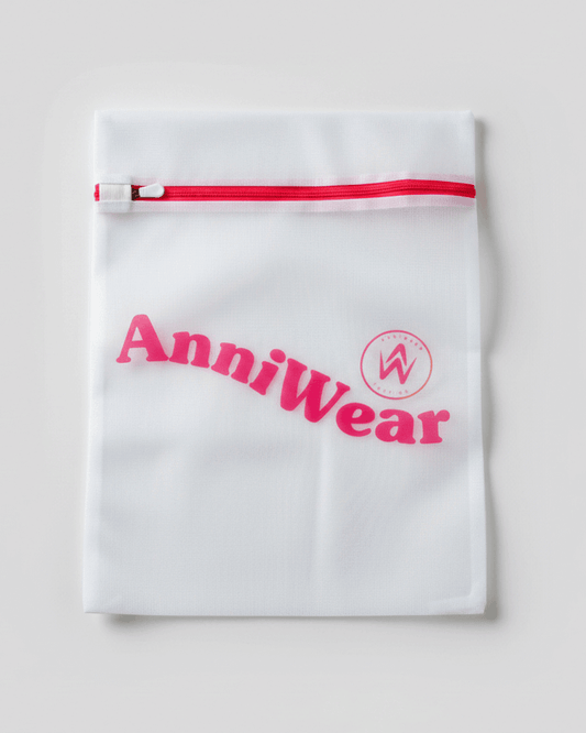 White mesh bag with red zipper and 'AnniWear' branding on a light gray background