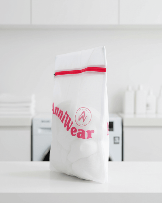 White mesh laundry bag with red zipper and 'AnniWear' branding on a white background.