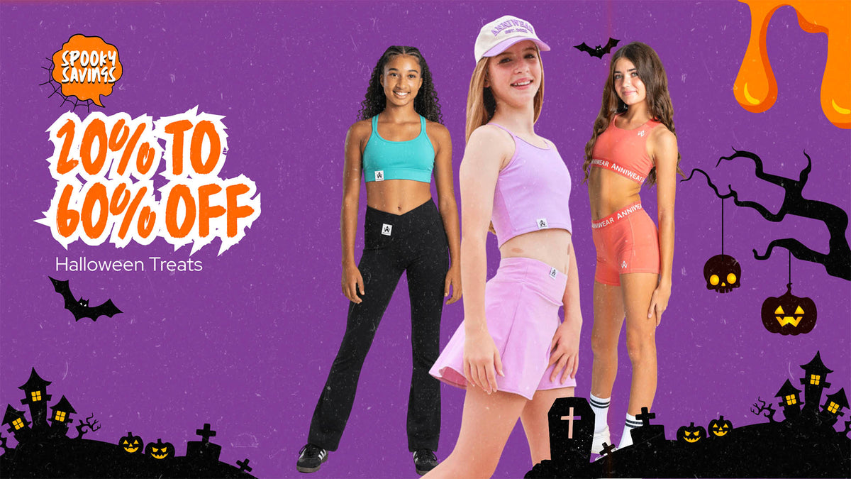 Three young women modeling matching athletic wear in turquoise, light purple, and coral colors, posed against a purple Halloween-themed background with '20% TO 60% OFF' text and 'Spooky Savers' branding.