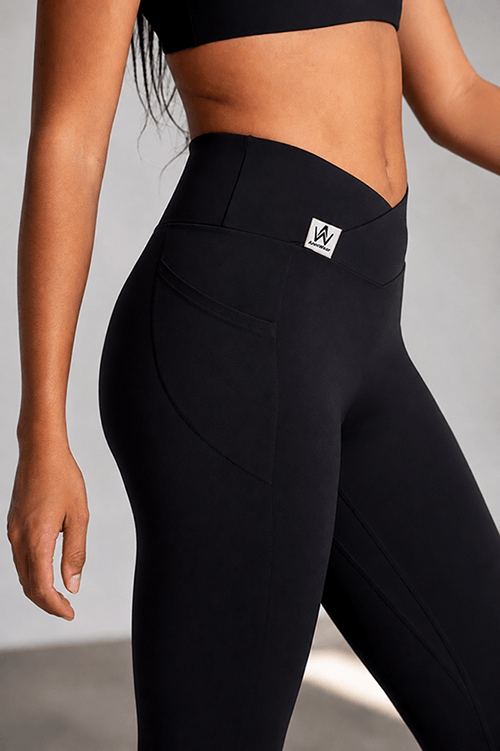 Black leggings worn by a person on a white background