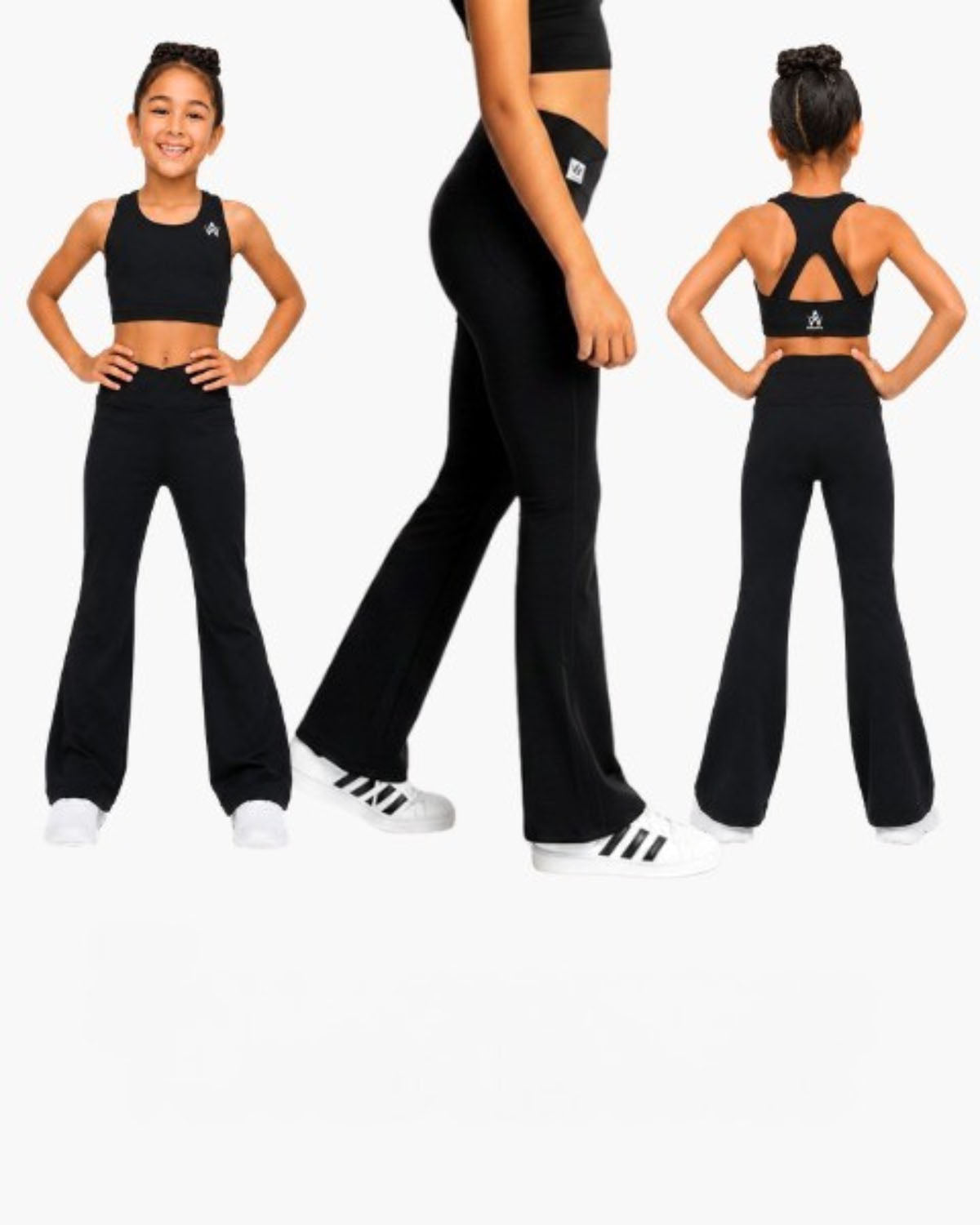 A young girl modeling a black two-piece activewear set consisting of a crop top and wide-leg pants, shown in three views: front, side, and back. She is wearing white sneakers against a plain white background.